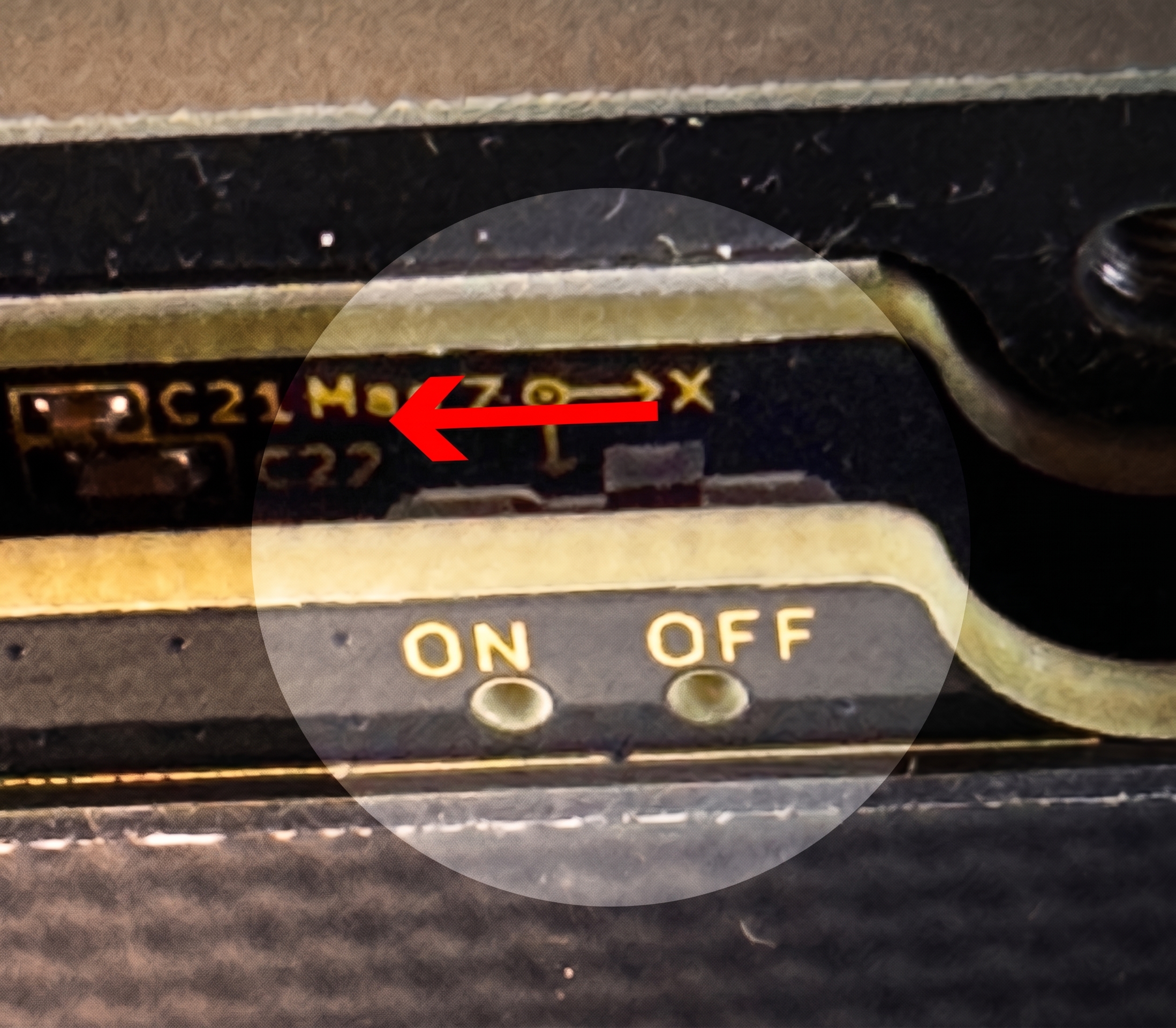 Close-up of the side power switch on the front PCBA with the silkscreen ON / OFF label