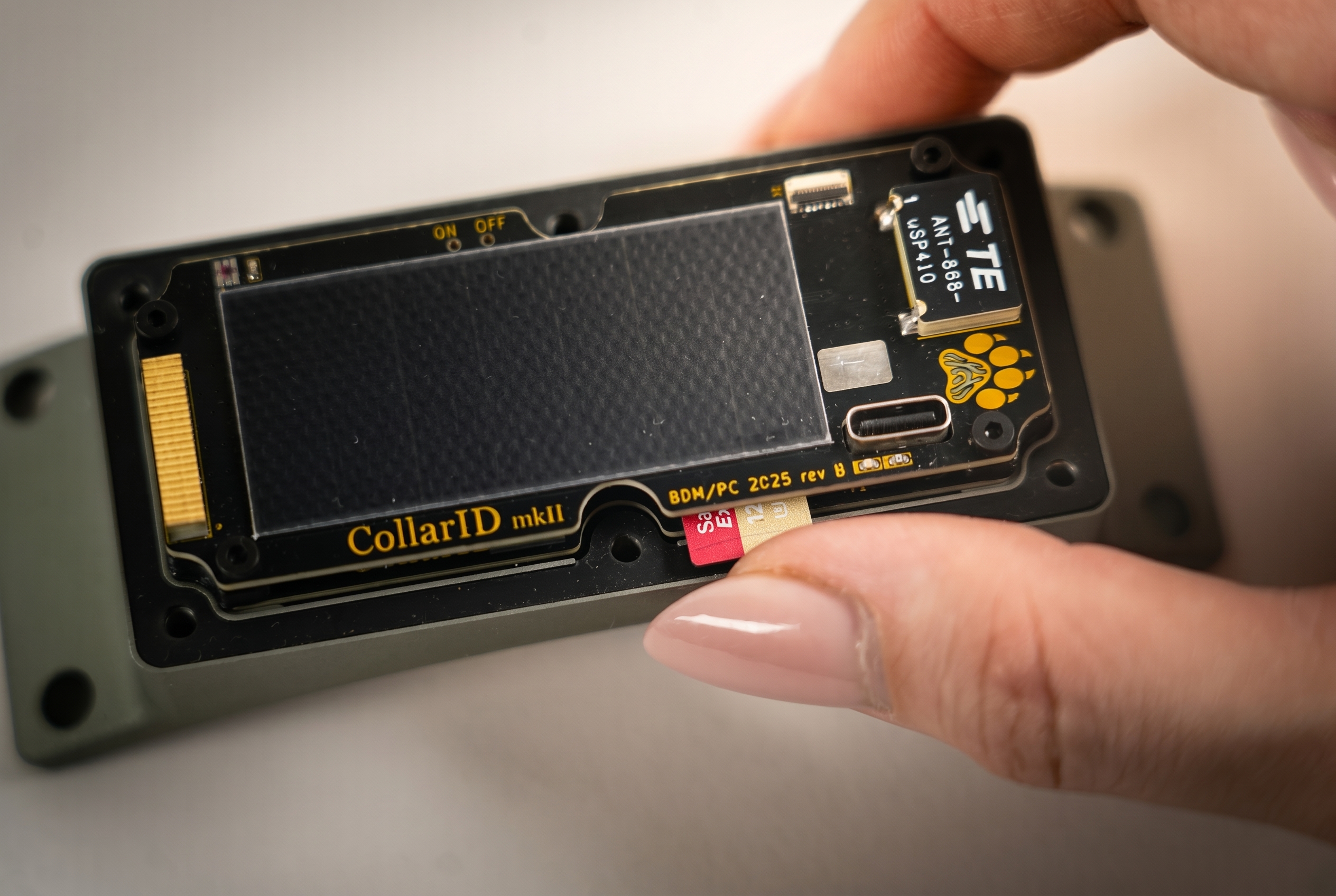 SD card popped partway out of the slot after the spring released